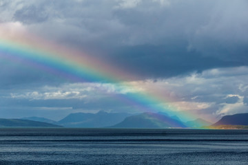 Rainbow. Rainbow over a fjord in Norway. Norwegian. Rain.