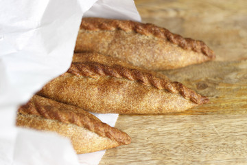 Vegetarian samosa in a craft pack on a table, closeup