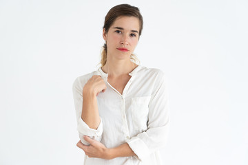 Relaxed pretty young woman looking at camera. Woman portrait concept. Isolated front view on white...