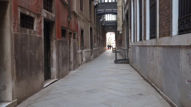 Narrow streets of Venice. Ancient narrow streets and facades of old medieval buildings