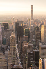 Fototapeta premium New York City skyline with Manhattan urban skyscrapers at dramatic after the storm sunset over famous 5th avenue, USA.