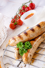 delicious bratwurst with ketchup and fresh rolls