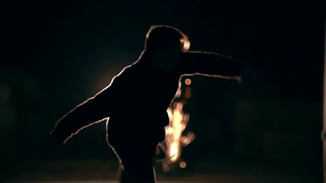 Tricks of martial arts, feilong, night against the background sparks, slow-motion
