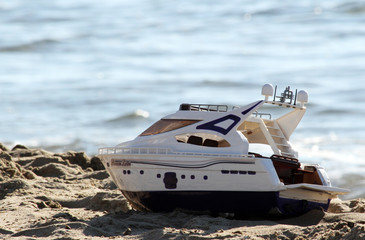 toy boat on the beach