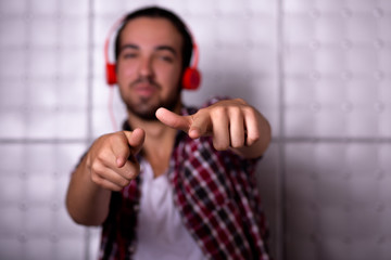 Close up image of cool boy listening to music. Isolated on white background.