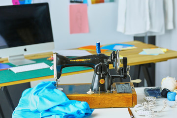 Empty workroom and workplace of tailor or vendor of clothes in small boutique