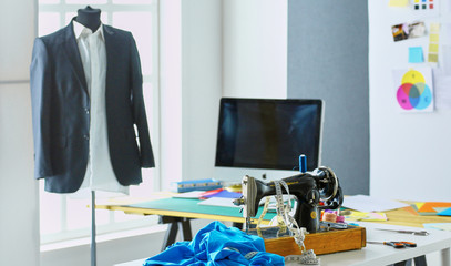 Empty workroom and workplace of tailor or vendor of clothes in small boutique
