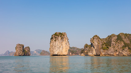 Fototapeta na wymiar Ha Long Bay in North Vietnam. The bay features thousands of limestone karsts and isles in various shapes and sizes.