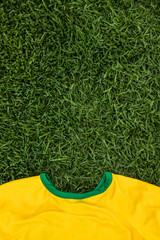 Brasil shirt placed on the lawn of the soccer field. Uniform of the brasilian team stretched out on the soccer field in the world championship