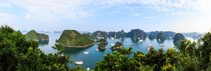 Panoramic view of Ha Long Bay islands, tourist boat and seascape, Ha Long, Vietnam.