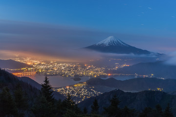 Night landscape of Mountain Fuji with cloudy sky and Kawaguchiko lake seen from Shindo toge view...