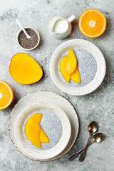 Healthy breakfast set. Chia seed pudding bowls with mango.