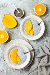 Healthy breakfast set. Chia seed pudding bowls with mango.