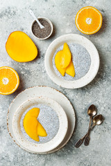 Healthy breakfast set. Chia seed pudding bowls with mango.