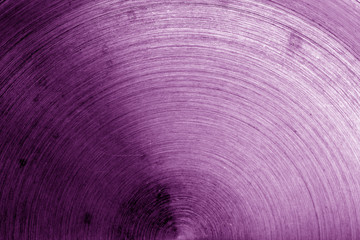 Metal surface with scratches in purple tone.