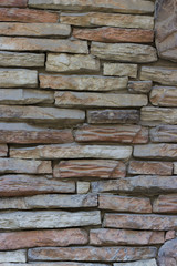 Wall of rectangular stones with cement close-up, texture, background