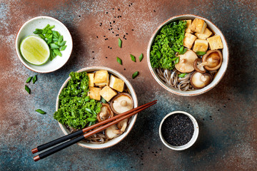 Miso and soba noodles soup with kale, shiitake mushrooms, .roasted tofu