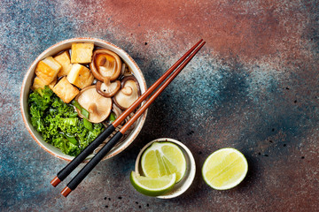 Miso and soba noodles soup with kale, shiitake mushrooms, .roasted tofu