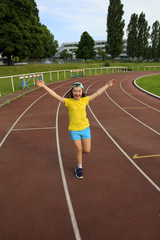 Obraz premium Little girl have fun on the stadium