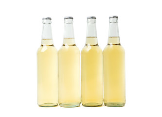 Four yellow bottles of beer on white background. 