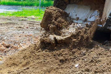 Earth moving by a bulldozer in the construction of a road Hydraulic hammer for backhoe © ungvar