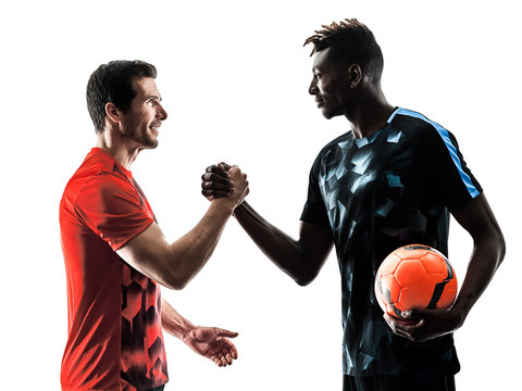 two soccer players men in studio silhouette isolated on white background