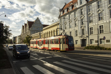 A public transport tram rides along the Gdansk street. Poland