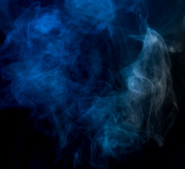Abstract blue smoke on a dark background