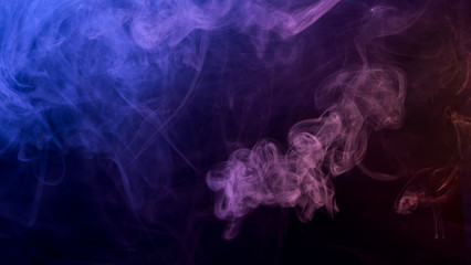 Abstract blue and pink smoke on a dark background