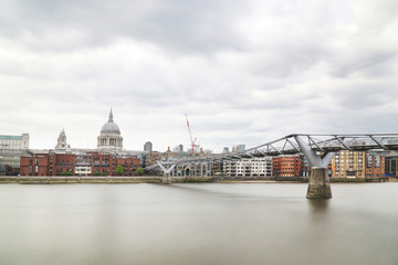 London, Millennium Bridge with St.Paul's Cathedral on a cloudy day.