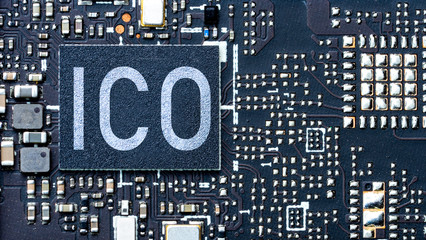 ICO,  Initial coin offering concept. PC circuit board background