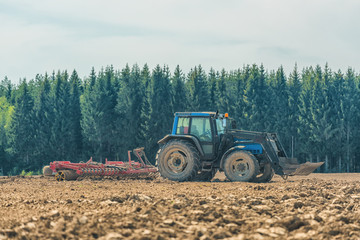 Picture of farmer plowing stubble field