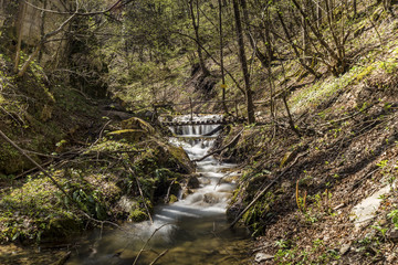 Small waterfall and a bridge