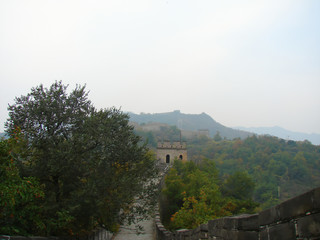 Fototapeta na wymiar the Great Wall of China; mountains and dense park around