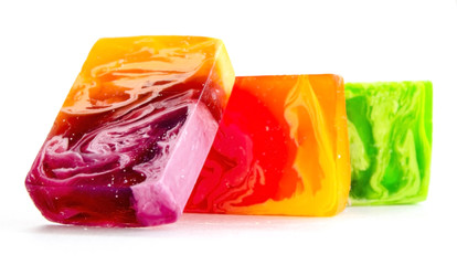 Piece of handmade bright soap. Close-up on a white background