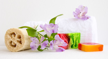 bathroom accessories, luff,  alstroemeria flower, handmade soap and white towel