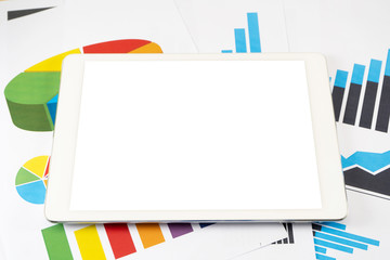 Blank white screen tablet on business graph