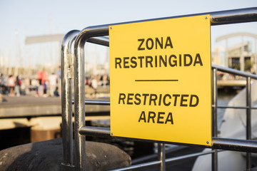 Restricted area signboard, written in Spanish and English