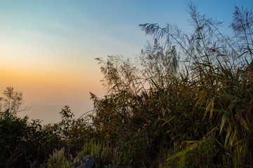 Obraz na płótnie Canvas Light sunset behind the mountains Nern Chang Suek hills, Kanchanaburi, Thailand