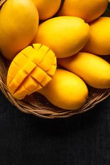 Yellow Mango Beautiful skin In the basket Blackboard background