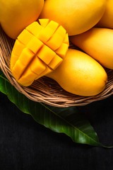 Yellow Mango Beautiful skin In the basket Blackboard background