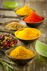 Wooden table of colorful spices