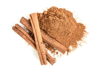 Homemade oatmeal cookies with raisins, cinnamon with milk on dark wooden background.