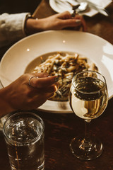 Person eats a fancy pasta in a nice restaurant 