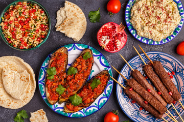 Classic kebabs, tabbouleh salad, baba ganush and baked eggplant with sauce.
