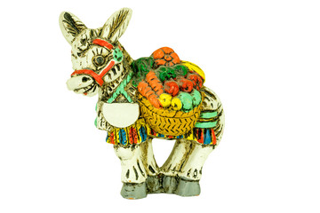 Toy donkey with fruits and vegetables isolated on white background. Close up. A shield with space for your text.