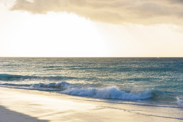 Idyllic caribbean beach at sunset