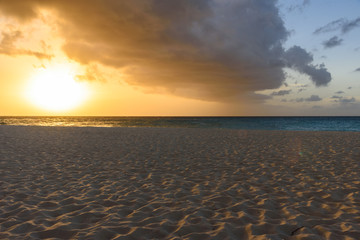 Idyllic caribbean beach at sunset