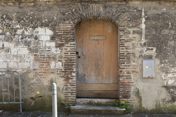 Old door with brick wall
