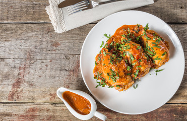 Squid stuffed with rice, olives and feta cheese in tomato sauce. The national dish of the Greek...